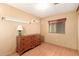 Simple secondary bedroom with bright lighting and laminate flooring with a spacious closet at 7807 E Main St # Cc105, Mesa, AZ 85207