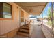 Inviting mobile home entry featuring a covered porch and well-maintained stairs with nice railings at 7807 E Main St # Cc105, Mesa, AZ 85207