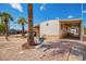 Manufactured home with a covered carport, mature landscaping, and a satellite dish at 7807 E Main St # Cc105, Mesa, AZ 85207