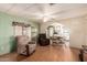 Cozy living room with laminate flooring and soft color palette adjacent to the kitchen and dining area at 7807 E Main St # Cc105, Mesa, AZ 85207