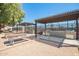 Outdoor kitchen with grills, picnic tables and tennis courts at 7807 E Main St # Cc105, Mesa, AZ 85207