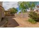 A spacious backyard with a covered patio and a sturdy block wall, perfect for entertaining at 826 W Devon Dr, Gilbert, AZ 85233