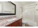 Bathroom featuring vanity with granite countertop and shower-tub combo at 826 W Devon Dr, Gilbert, AZ 85233