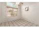 Bright bedroom with tile floors, neutral walls, and a large window, offering a serene and inviting space at 826 W Devon Dr, Gilbert, AZ 85233