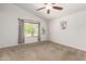Spacious bedroom with vaulted ceilings, a large window, neutral carpet and soft, light-gray walls at 826 W Devon Dr, Gilbert, AZ 85233