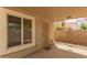 A cozy covered patio with brick pavers, offering a shaded outdoor living space at 826 W Devon Dr, Gilbert, AZ 85233
