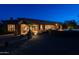 Back exterior view showing a patio, desert landscaping, fire pit and an outdoor seating area at 8392 E Eagle Feather Rd, Scottsdale, AZ 85266