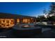 Expansive backyard with a pool, spa, fire pit, and covered patio perfect for entertaining or relaxation at 8392 E Eagle Feather Rd, Scottsdale, AZ 85266