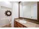 Bathroom featuring a dark wood mirror at 8392 E Eagle Feather Rd, Scottsdale, AZ 85266