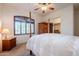 Bright bedroom with a large window and a wooden dresser at 8392 E Eagle Feather Rd, Scottsdale, AZ 85266