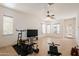 Bright bonus room with tile flooring, large windows, and ceiling fan at 8392 E Eagle Feather Rd, Scottsdale, AZ 85266
