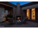Cozy courtyard featuring an outdoor fireplace and comfortable seating for relaxing evenings at 8392 E Eagle Feather Rd, Scottsdale, AZ 85266