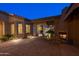 Picturesque courtyard with fireplace and outdoor seating perfect for enjoying tranquil evenings at 8392 E Eagle Feather Rd, Scottsdale, AZ 85266