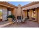 Warm seating in a cozy courtyard with fireplace and desert landscaping at 8392 E Eagle Feather Rd, Scottsdale, AZ 85266