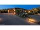 Inviting home exterior with a desert-landscaped front yard and a paved driveway at 8392 E Eagle Feather Rd, Scottsdale, AZ 85266