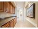 Hallway with lots of wooden cabinets and counter space at 8392 E Eagle Feather Rd, Scottsdale, AZ 85266