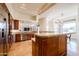 Spacious kitchen with wood cabinets, granite countertops, stainless steel appliances, and tile flooring at 8392 E Eagle Feather Rd, Scottsdale, AZ 85266