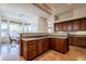 Modern kitchen boasts granite counters, tile flooring, and stainless steel gas cooktop at 8392 E Eagle Feather Rd, Scottsdale, AZ 85266