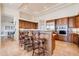 Bright kitchen featuring stainless appliances, granite counters, and breakfast bar at 8392 E Eagle Feather Rd, Scottsdale, AZ 85266