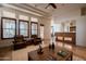 Open concept living room featuring fireplace, neutral tones, and access to kitchen at 8392 E Eagle Feather Rd, Scottsdale, AZ 85266
