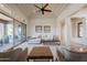 Bright living room featuring modern furniture, neutral tones, and patio access at 8392 E Eagle Feather Rd, Scottsdale, AZ 85266