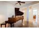 Living room with a dark wood piano at 8392 E Eagle Feather Rd, Scottsdale, AZ 85266