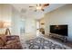 Inviting living room featuring tile floors, a decorative rug, and recessed lighting at 8392 E Eagle Feather Rd, Scottsdale, AZ 85266