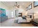 Inviting main bedroom with a cozy fireplace, ceiling fan, and neutral tones creating a relaxing space at 8392 E Eagle Feather Rd, Scottsdale, AZ 85266