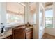 Office nook features stone countertops, views to the backyard and a leather chair at 8392 E Eagle Feather Rd, Scottsdale, AZ 85266