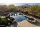 Luxurious pool and spa with desert landscaping and mountain views at 8392 E Eagle Feather Rd, Scottsdale, AZ 85266