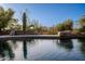 Beautiful pool featuring desert landscaping and mature Saguaro cactus at 8392 E Eagle Feather Rd, Scottsdale, AZ 85266