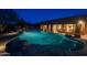 Beautifully landscaped backyard swimming pool with stone accents and a spacious patio area at 8392 E Eagle Feather Rd, Scottsdale, AZ 85266