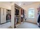 Walk-in closet featuring built-in shelves and ample storage space at 8392 E Eagle Feather Rd, Scottsdale, AZ 85266