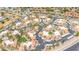 Panoramic aerial view of the community showcasing meticulously landscaped grounds, tennis courts, and numerous parking areas at 8787 E Mountain View Rd # 1087, Scottsdale, AZ 85258