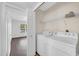 Convenient in-unit laundry room featuring a side-by-side washer and dryer set at 8787 E Mountain View Rd # 1087, Scottsdale, AZ 85258