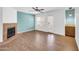 Cozy living room with a fireplace, laminate floors, and sliding glass doors at 8787 E Mountain View Rd # 1087, Scottsdale, AZ 85258