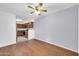 Spacious living room with laminate flooring and open access to the kitchen at 8787 E Mountain View Rd # 1087, Scottsdale, AZ 85258