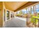 Enjoy a large covered patio with views of the community, mature palms, and barbecue grills at 8787 E Mountain View Rd # 1087, Scottsdale, AZ 85258
