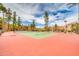 Well-maintained tennis court within the community, surrounded by landscaping and trees, for active enjoyment at 8787 E Mountain View Rd # 1087, Scottsdale, AZ 85258