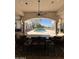 Outdoor living space with a pool, overhead fan, and dining furniture in a covered setting at 9267 E Rimrock Dr, Scottsdale, AZ 85255