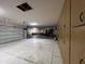 Spacious garage with storage cabinets, room for multiple vehicles, and an access door at 9267 E Rimrock Dr, Scottsdale, AZ 85255
