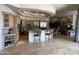 Spacious kitchen boasts a large island, high-end appliances, and seamless flow into the living area at 9267 E Rimrock Dr, Scottsdale, AZ 85255