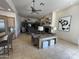 Open living room featuring fireplace, media center, and bar with seating at 9267 E Rimrock Dr, Scottsdale, AZ 85255