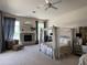 Main bedroom with fireplace, sitting area, and view to backyard at 9267 E Rimrock Dr, Scottsdale, AZ 85255