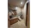 Elegant powder room with designer wallpaper, custom mirror and sconces, and granite vanity at 9267 E Rimrock Dr, Scottsdale, AZ 85255