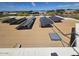 Energy-efficient home featuring solar panels, set within a serene desert landscape at 9267 E Rimrock Dr, Scottsdale, AZ 85255