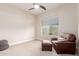 Cozy bedroom with a brown leather lounge chair at 9369 W Via Montoya Dr, Peoria, AZ 85383