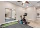 Exercise room with workout equipment, mirrored wall, and neutral carpet at 9369 W Via Montoya Dr, Peoria, AZ 85383
