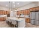 Gourmet kitchen features a large island with bar seating and stainless steel appliances at 9369 W Via Montoya Dr, Peoria, AZ 85383