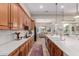 Eat-in kitchen features wood cabinets and stainless appliances at 9369 W Via Montoya Dr, Peoria, AZ 85383
